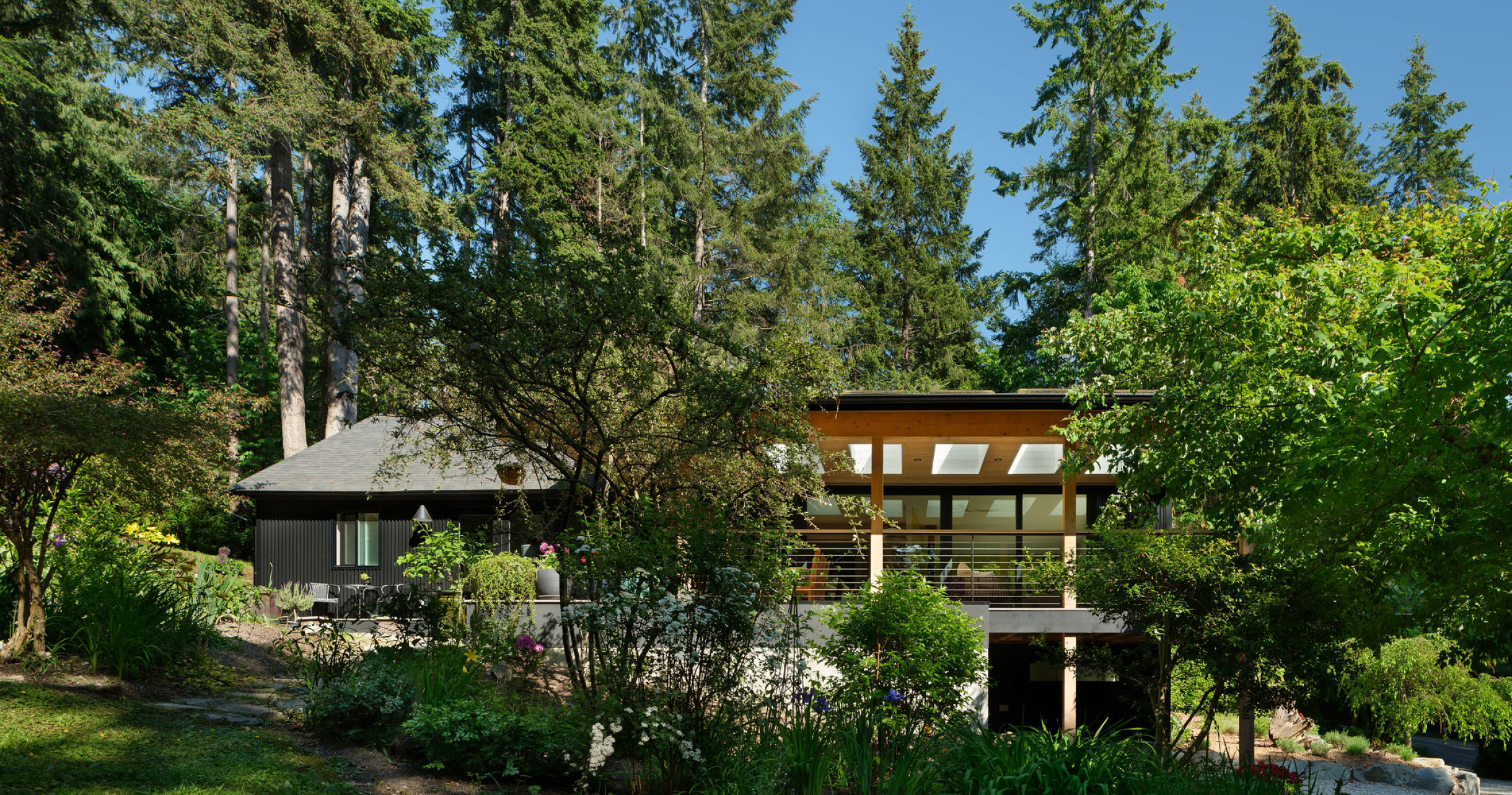 An elegant front garden with modern landscaping enhances the sophisticated appeal of the home