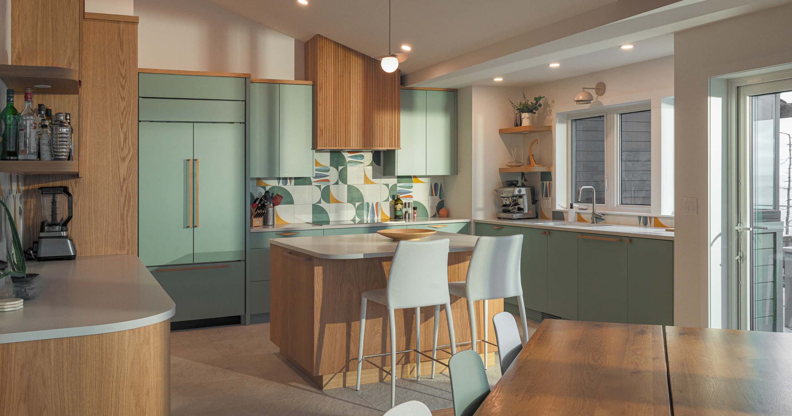 The kitchen is equipped with top-of-the-line appliances, and expansive ocean views