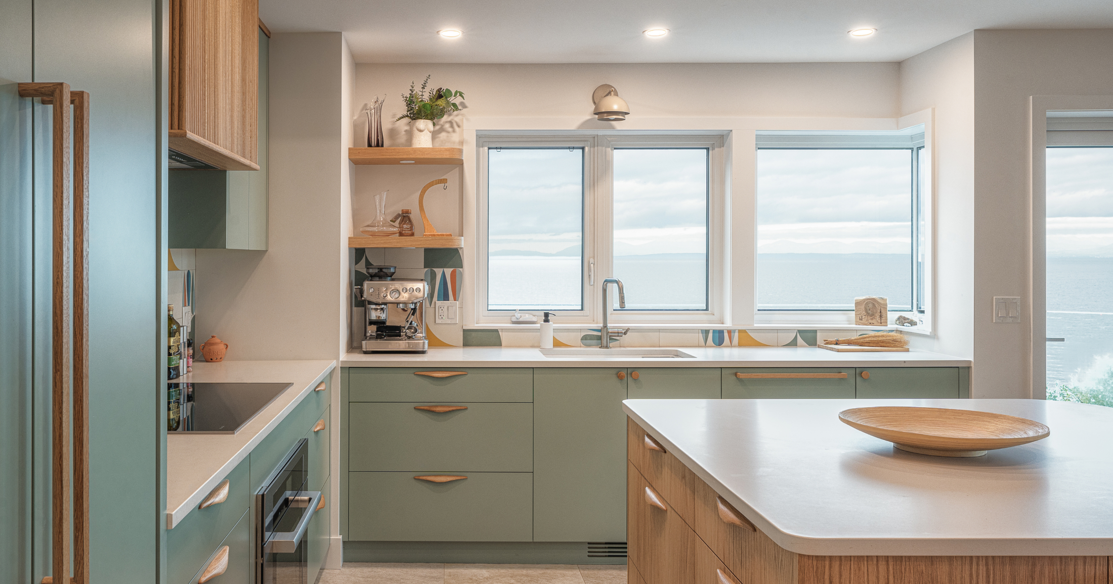 The kitchen is equipped with top-of-the-line appliances, and expansive ocean views