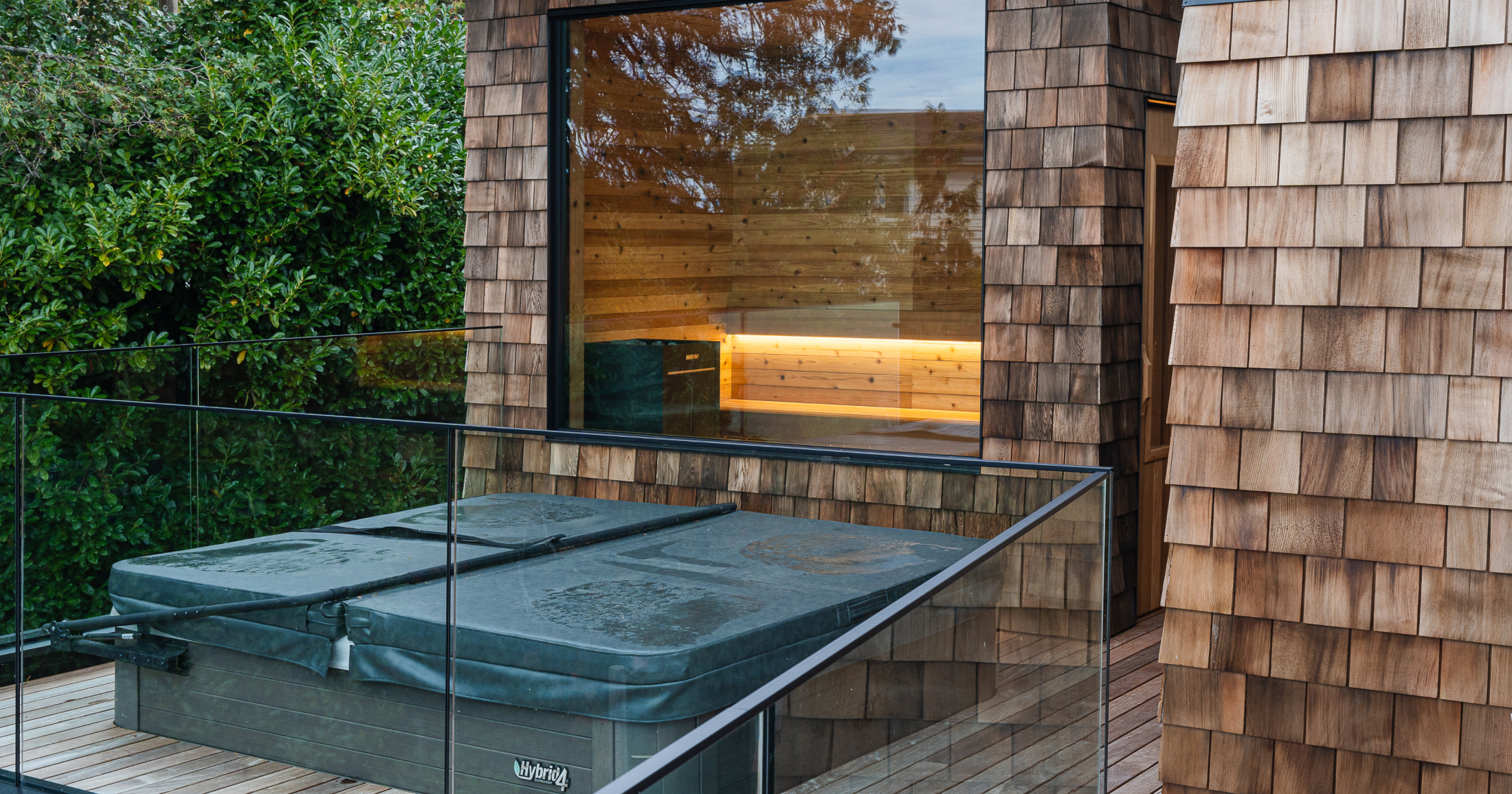 Outdoor hot-tub and sauna area make for spa like experiences in the home